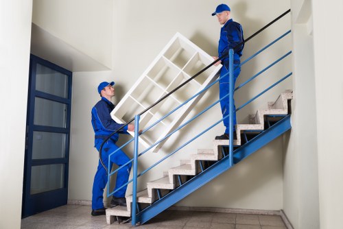 Moving team handling apartment furniture in Woodford