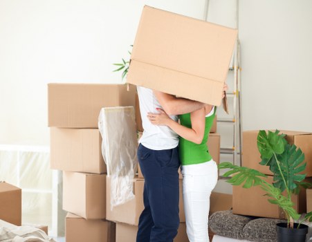 Small removals vehicle transporting boxes and furniture in Woodford