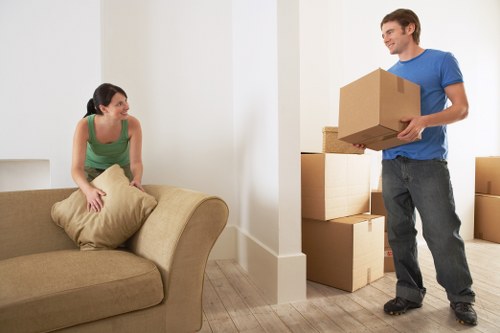 Careful loading of furniture into a removals van in Woodford